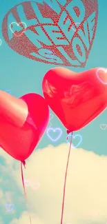 Romantic red heart balloons floating in a blue sky with fluffy clouds.