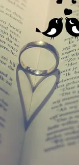 Romantic wallpaper with heart shadow on book page.