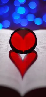 Romantic heart shadow on book with blue bokeh background.