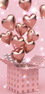 Metallic hearts burst from a polka dot box on a pink background.