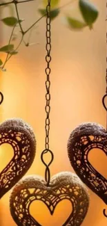 Ornate hanging heart chains with warm glow