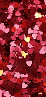 Romantic heart confetti wallpaper in red and pink tones.