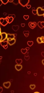 Glowing red and orange heart bokeh wallpaper.