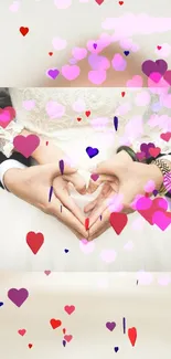 Romantic heart-shaped hands with colorful hearts on wallpaper.