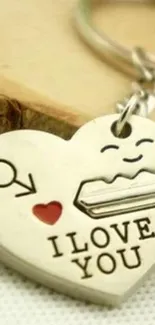 Heart-shaped keychain with 'I Love You' engraving on cream background.