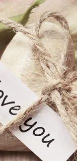 Rustic heart with twine and love note wallpaper.