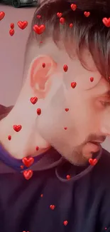 Side profile of a man with floating red hearts on a mobile wallpaper.