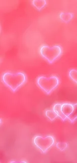 Pink neon hearts wallpaper with a romantic glow.