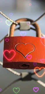 Red heart padlock on a blurred fence background.