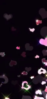 Mobile wallpaper with glowing pink hearts on a dark background.