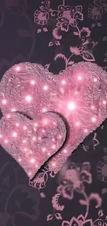 Romantic pink heart wallpaper with glowing floral accents.