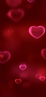 Romantic red glow wallpaper with floating hearts.