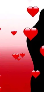 Silhouette of a couple with red hearts on a gradient background.