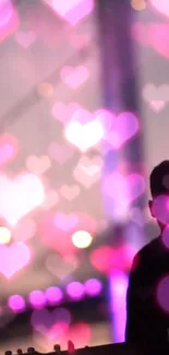 Romantic silhouette with glowing pink hearts in the background.