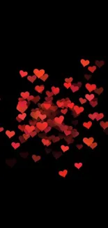 Vibrant red hearts scattered on black background