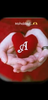 Red heart held in hands against dark background.