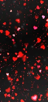 Vibrant red hearts on a black background, perfect for a romantic mobile wallpaper.