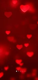 Romantic red hearts wallpaper with glowing effect.