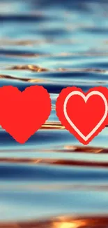 Vibrant red hearts on a tranquil water background.