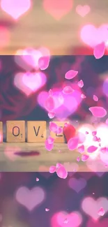 Romantic wallpaper with pink hearts and Scrabble tiles spelling LOVE.