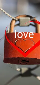 Red love lock on wire with heart design and 'love' text.