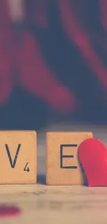 Scrabble 'LOVE' tiles with red heart.