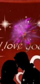 Romantic silhouette couple mobile wallpaper with red background and fireworks.