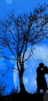 Silhouette of couple kissing under a moonlit tree.