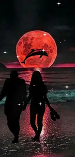 Silhouetted couple walks along a beach under a vivid red moon with dolphin in sky.