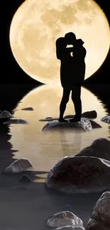 Romantic silhouette of a couple kissing in moonlight reflection on water with rocks.