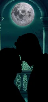 Silhouette of a couple embracing under a full moon with dark teal tones.