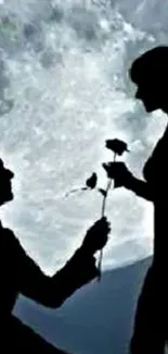 Silhouette of a couple under a full moon in a romantic scene.