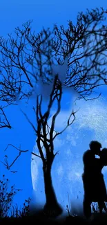 Silhouette of a couple kissing under a tree in moonlight.