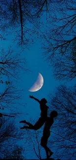 Silhouette of a couple under a crescent moon in a dark, forested night sky.