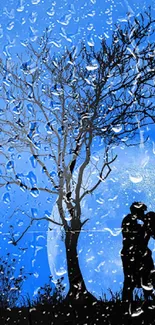 Silhouette of a couple kissing under a tree against a full moon.