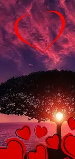 Romantic heart and sunset with tree silhouette wallpaper.