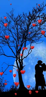 Silhouette of couple under moonlit blue night sky.