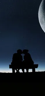 Silhouette of couple under a starry sky and crescent moon at night.