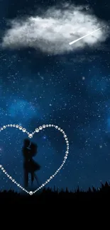 Silhouetted couple in heart with starry night sky