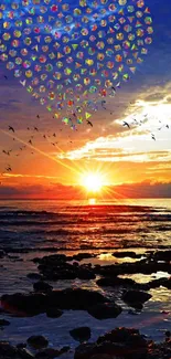 Sunset over ocean with heart-shaped sky and birds flying.