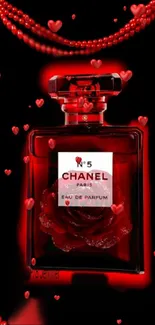 Red perfume bottle with heart accents on a dark background.