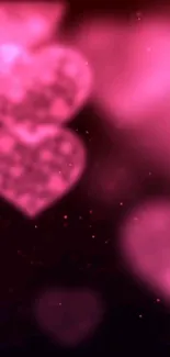 Romantic pink heart wallpaper with bokeh effect.