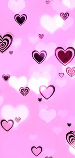 Pink heart mobile wallpaper with romantic heart patterns and a soft, glowing effect.