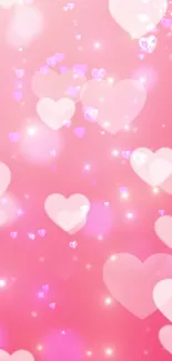 Romantic pink hearts with glowing sparkles on a soft pink background.