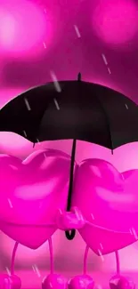 Two pink hearts under a black umbrella on a hot pink background.