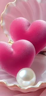Pink hearts inside a shell with a pearl.