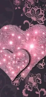 Romantic pink heart wallpaper with glowing effects and floral patterns.