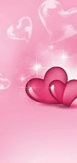 Romantic mobile wallpaper with glossy pink hearts and a soft pink backdrop.