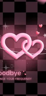 Two interlocking pink hearts on a checkerboard background.