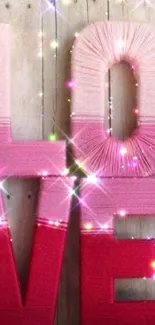 Pink themed love decor with yarn and lights.